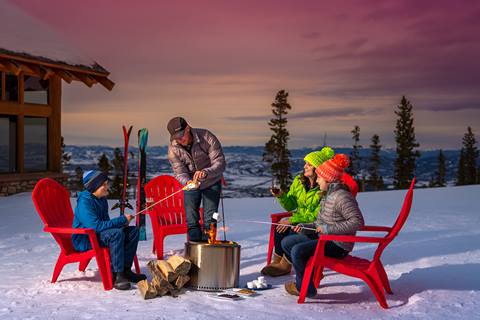 Family at aprés making smores at Winter Park Resort