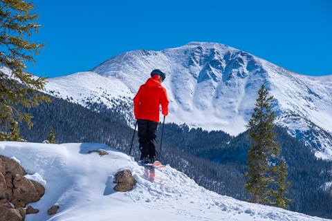 skier in front of parry peak