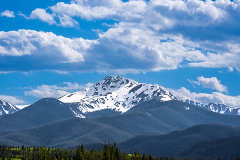 Scenic photo of a snowy peak washed in sunshine.