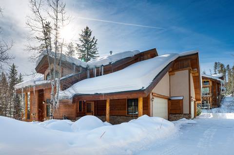 Winter Exterior of a townhome covered in snow in Winter Park Colorado. 