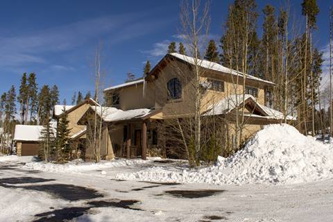 Exterior view of home with snow