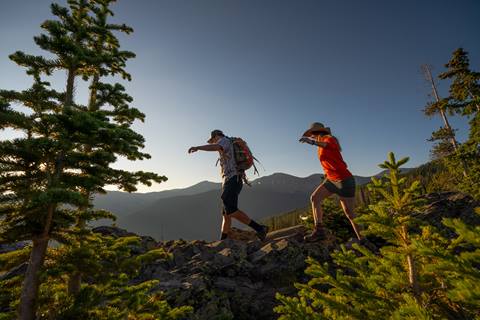 two people hiking in the rocky mountains in colorado at winter park resort in the summer