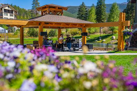 Summer time at the Gazebo in the Village at Winter Park Resort with live band and flowers