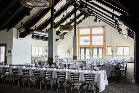 Dining room at an industrial styled mountaintop lodge wedding venue at Winter Park Resort