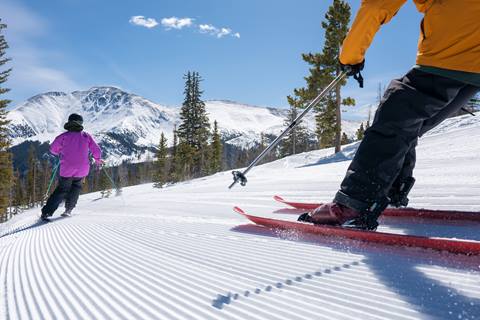 Two skiers at winter park resort 