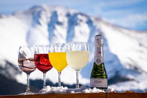 Champagne in glasses with mountains in the background