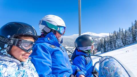 Kids on lift with instructor